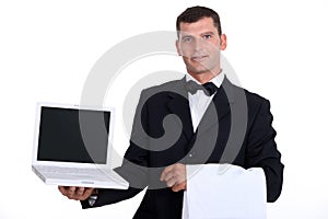 Waitor holding laptop