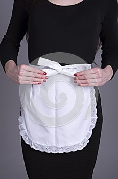 Waitress in black dress and white apron