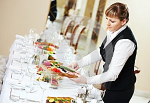 Waitress at catering work in a restaurant