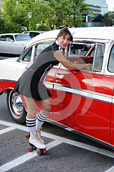 Waitress at drive-in restaurant photo