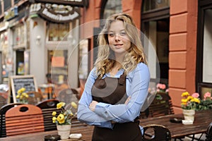 Waitress in front of restaurant photo