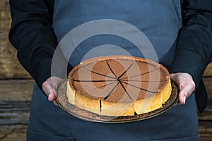 Waitress holding chocolate tort