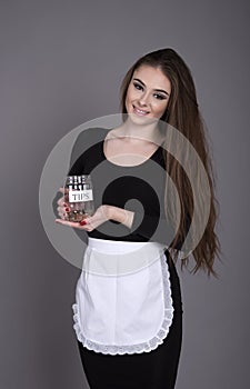 Waitress holding a tips container