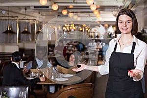Waitress meeting customers in restaurant