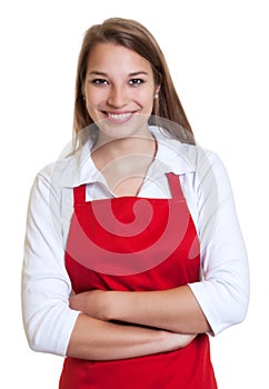Waitress with red apron and crossed arms