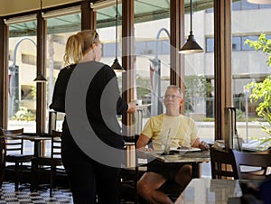 Waitress serves customer