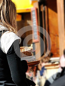 Waitress serves skiers outdoors