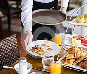 Waitress serving breakfast at a restaurant