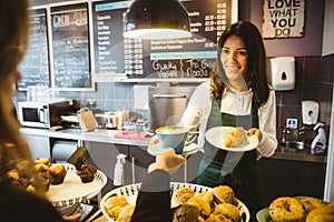 Waitress serving a cup of coffee photo