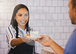 Waitress serving drink to customer in coffee shop, cafe and restaurant. Friendly woman, happy bistro worker and smile