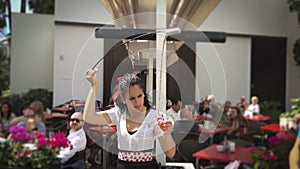 Waitress serving and pouring Sherry, a traditional habit called Venenciar in Malaga, Spain