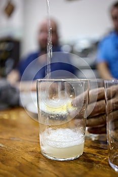 Waitress serving Txakoli, the most typical White Wine in Basque Country, Spain