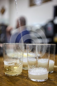 Waitress serving Txakoli, the most typical White Wine in Basque Country, Spain