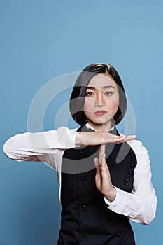 Waitress showing timeout with hands