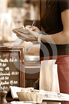 Waitress taking order