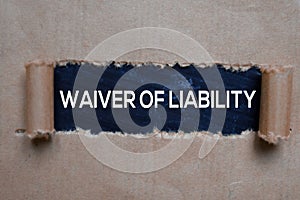 Waiver Of Liability Text written in torn paper