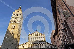 The wake of an airplane above the Duomo of Pistoia, Tuscany, Italy