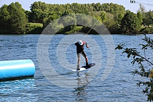 Wake-boarder almost touch down at Cergy water amusement park, France
