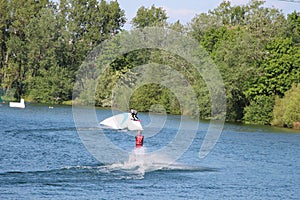 Wake-boarders and water sky at Cergy water amusement park, France