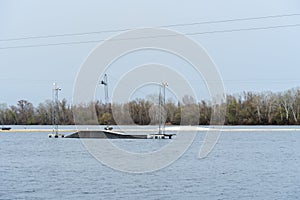 Wake cable park for wakeboarding on river. Pulley system reverse equipment wakeboard in water. Traction water snowboard halyard photo