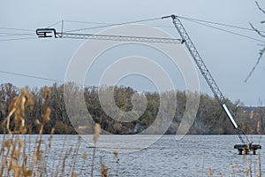 Wake cable park for wakeboarding on river. Pulley system reverse equipment wakeboard in water. Traction water snowboard halyard