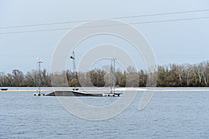 Wake cable park for wakeboarding on river. Pulley system reverse equipment wakeboard in water. Traction water snowboard halyard