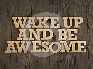 Wake up and be awesome, text words typography written with wooden letter, life and business motivational inspirational