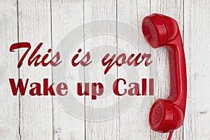 Wake up call text with retro red phone handset photo
