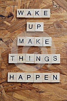 wake up make things happen text on wooden square, motivation quotes.