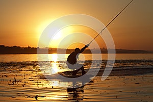 Wakeboard, athlete silhouette on sunset background