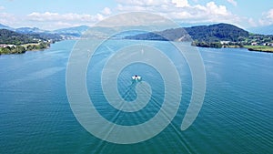 Wakeboard and Motorboat Lake Zurich, Switzerland. Watersport and drone aerial shot from behind