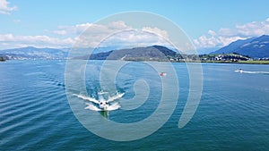 Wakeboard and Motorboat Lake Zurich, Switzerland. Watersport and drone aerial shot frontt view