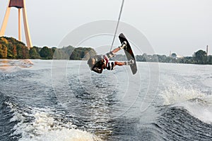 Wakeboarder jumping upside down
