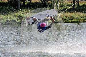 Wakeboarder jumping upside down