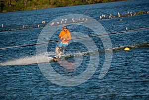 Wakeboarder makes a turn while training