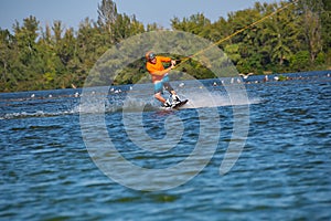 Wakeboarder trains in a cable park