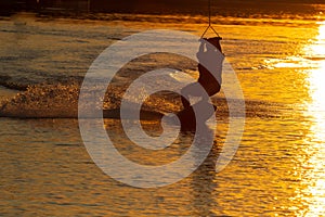 wakeboarder trains at sunset