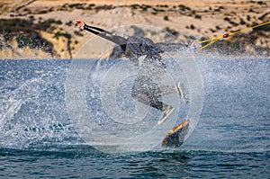 Wakeskater in a cable park doing tricks photo