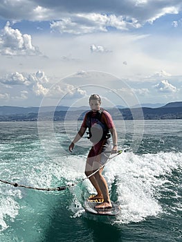 Wakesurfing woman on a lake