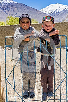 WAKHAN VALLEY, TAJIKISTAN - MAY 24, 2018: Local village boys in Wakhan valley, Tajikist