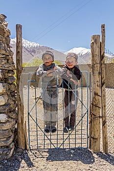 WAKHAN VALLEY, TAJIKISTAN - MAY 24, 2018: Local village boys in Wakhan valley, Tajikist