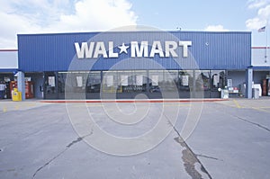 Wal * Mart Supercenter Store front entrance and parking lot in Southeast USA