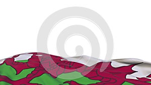 Wales fabric flag waving on the wind loop. Wales embroidery stiched cloth banner swaying on the breeze. Half-filled white