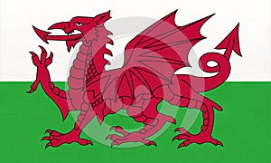 Wales national fabric flag, textile background. Symbol of part of United kingdom international world country