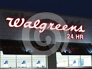 Walgreens sign on the wall in Edison on Rt 1 at late evening, NJ USA.