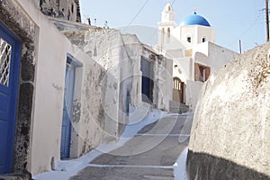 A walk at a ally way in the island of Santorini. Greece