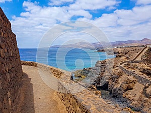 Walk along the Barranco del Quiquere between the coastal towns of Puerro del Carmen and Puerto Calero. Lanzarote, Spain photo