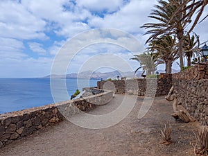 Walk along the coast between the coastal towns of Puerro del Carmen and Puerto Calero. Lanzarote, Spain photo