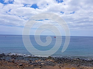 Walk along the coast between the coastal towns of Puerro del Carmen and Puerto Calero. Lanzarote, Spain photo