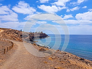 Walk along the coast between the coastal towns of Puerro del Carmen and Puerto Calero. Lanzarote, Spain photo